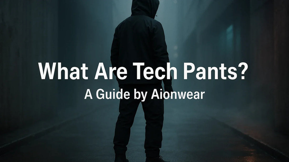 faceless model in techwear pants standing in urban alley