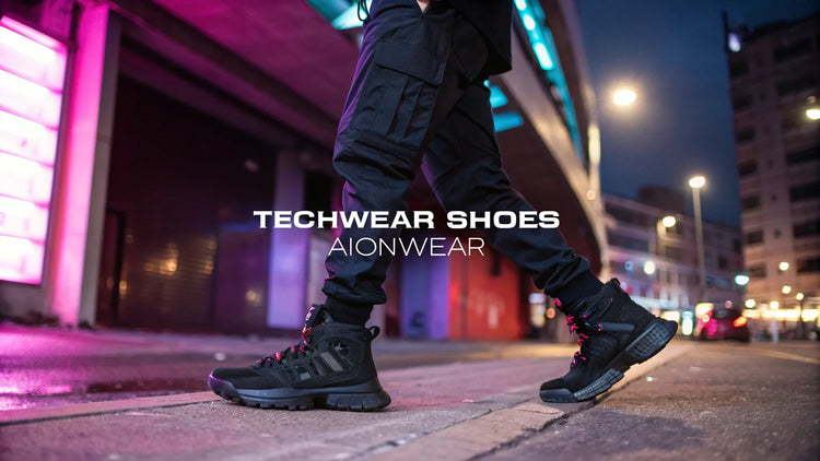 Close-up of futuristic black techwear shoes with neon city lights background, Aionwear style