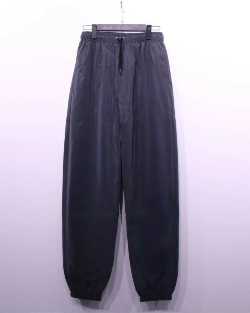 Eye-Catching Reflective Activewear - techwear style - Reflective Colorful Pants for Festive Style