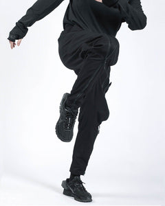 black pants with zippers on the legs
